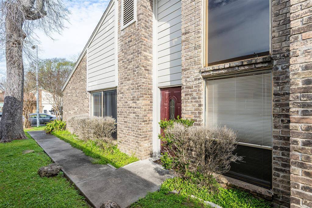 The main entry is located on the right side of the house, offering added security and enhanced privacy for residents.