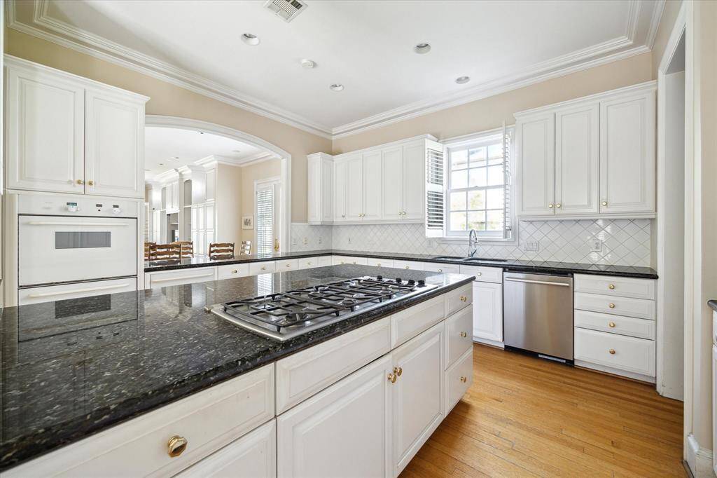 The family room has beautiful views to the backyard gardens and pool.