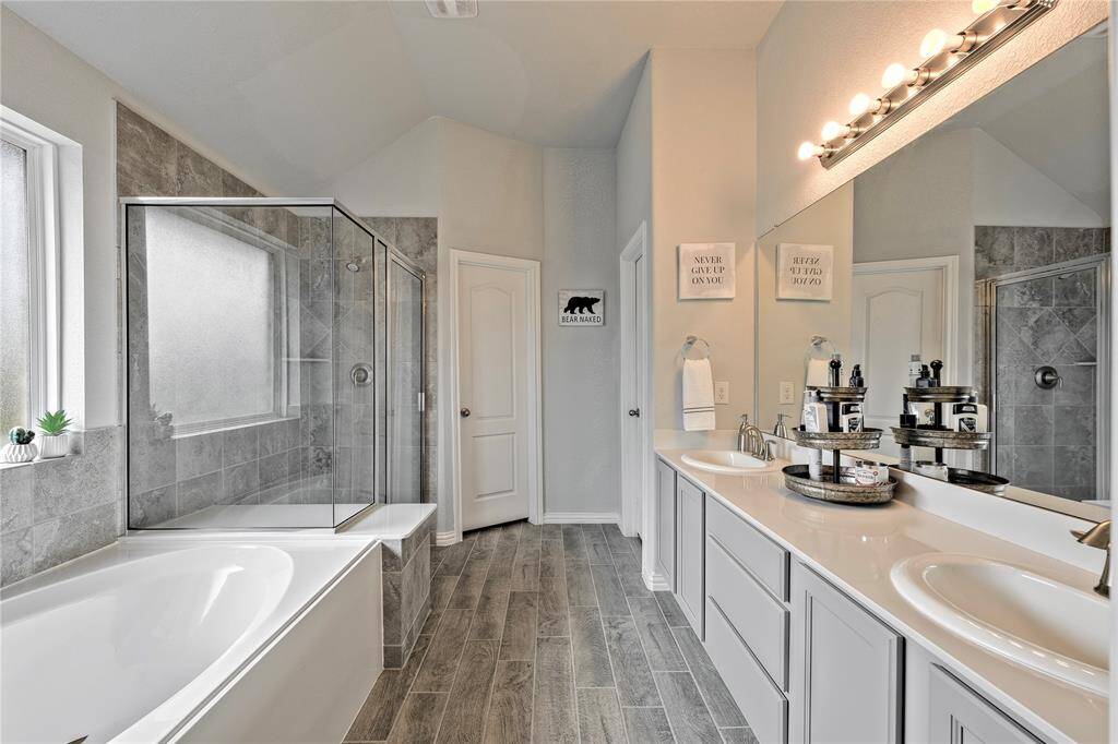 Primary Bath with Separate Tile Shower with soaking tub and dual vanity