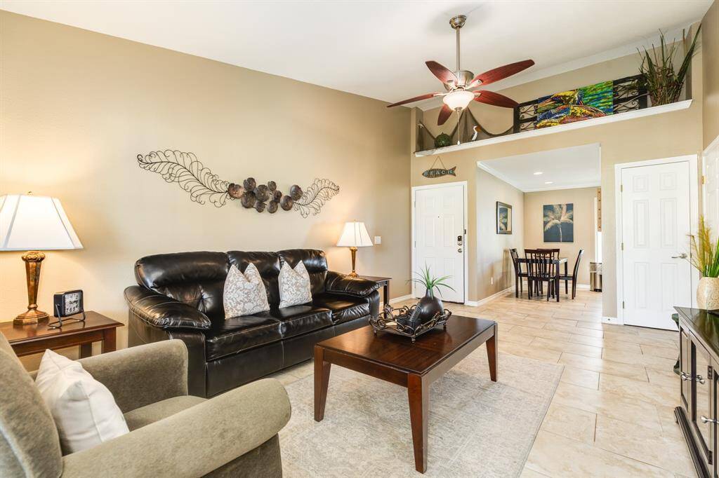 The high ceiling creates a nice space for you to display art pieces above the entrance going into the dining area.