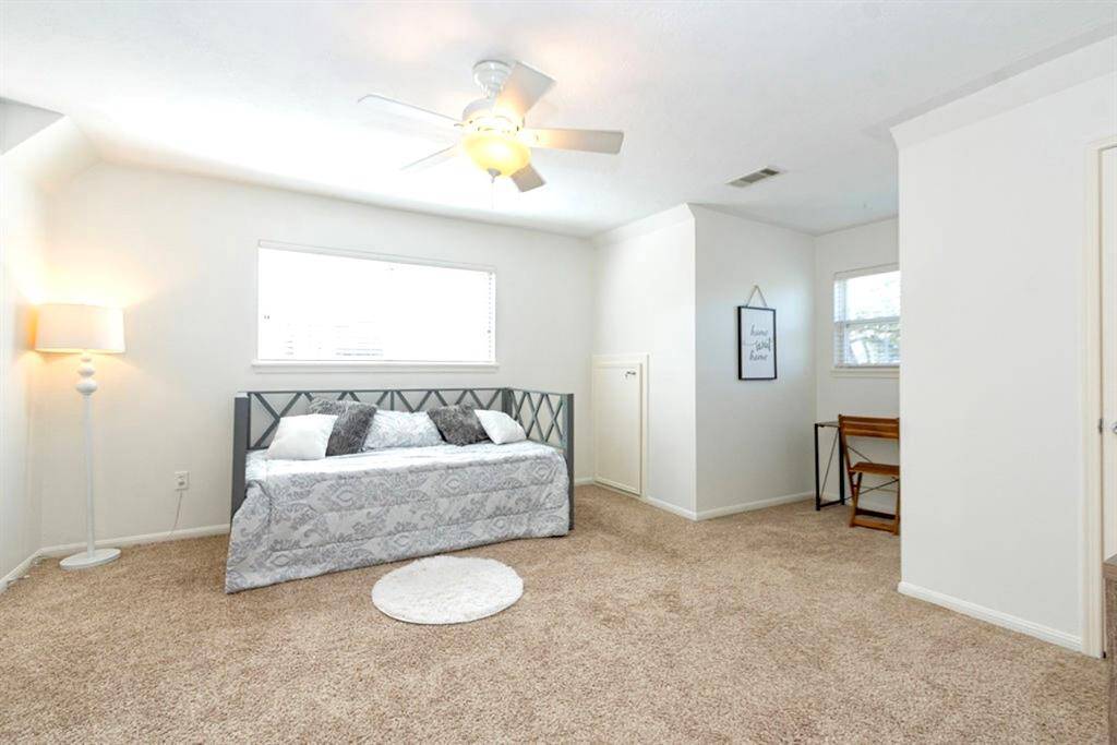 Bedroom 2 is on the right side of the home and has updated carpet, Low E Double Pane Windows, and a dormer space for a desk or reading area!