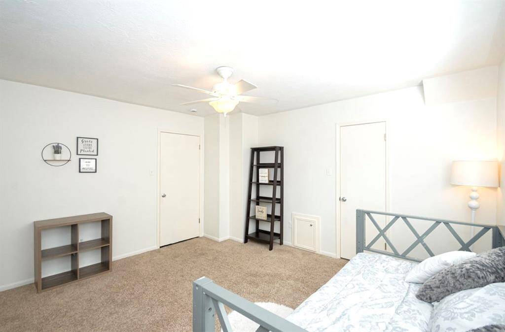 Bedroom 2 also has a ceiling fan with light and a large walk-in closet and attic access!