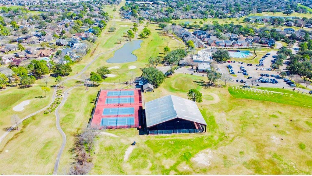 Aerial photo showcases the Tennis Courts, Pickleball Courts, covered Tennis Courts, the Golf Course, the Country Club, Pro Shop, the Tourn and the swimming pool! Memberships at varying levels are available! Hearthstone Country Club offers a vibrant community atmosphere to all residents!