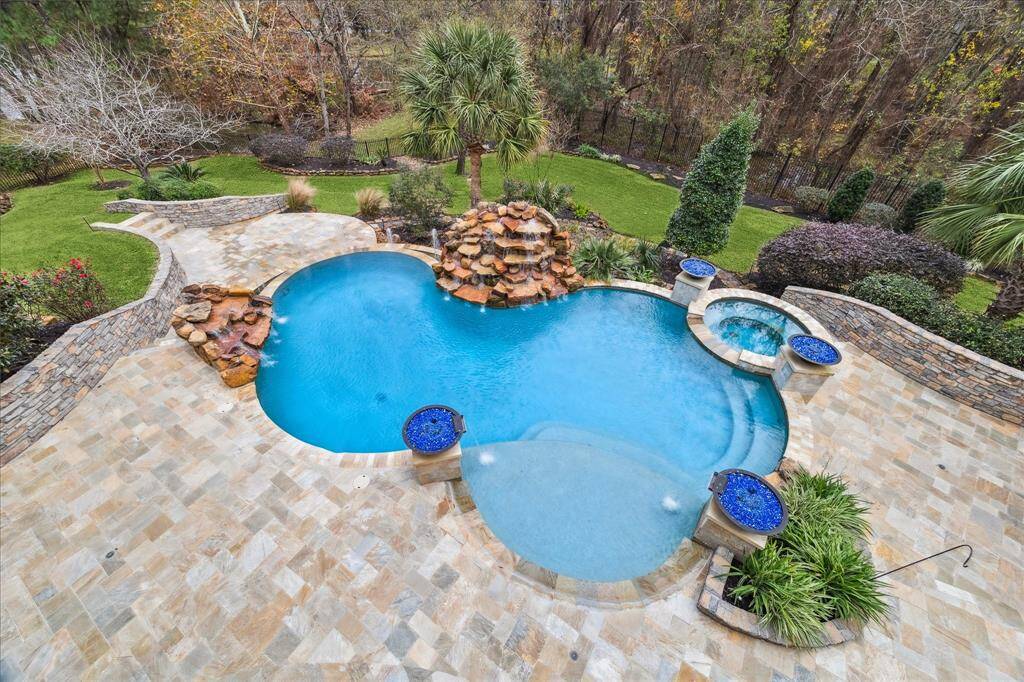 Enjoy your own private vacation spot with a pool, spa, Pavilion, outdoor summer kitchen, firepots and patios