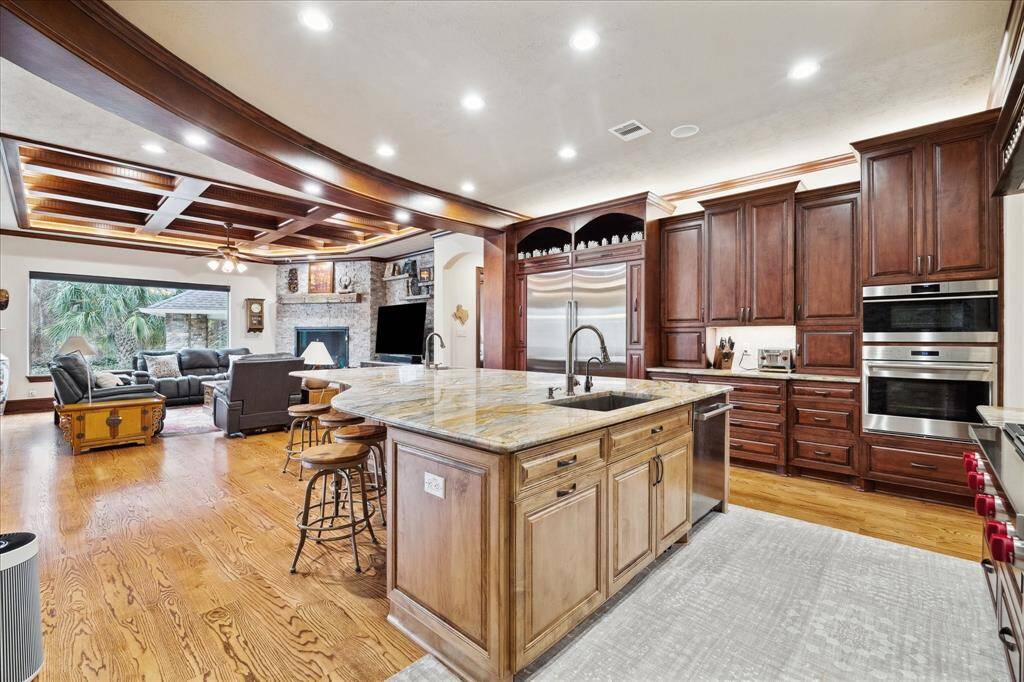 The counter tops are granite. There are double ovens and a separate microwave.  There are granite window sills on the first floor