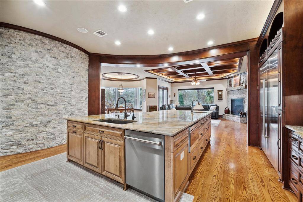 There are custom ceiling treatments throughout the first floor, as well as custom Pella windows and a whole house water filtration system
