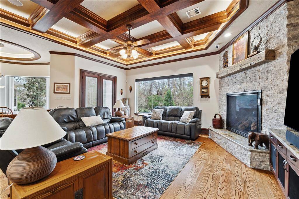 One of the two fireplaces on the first floor is featured in the family room