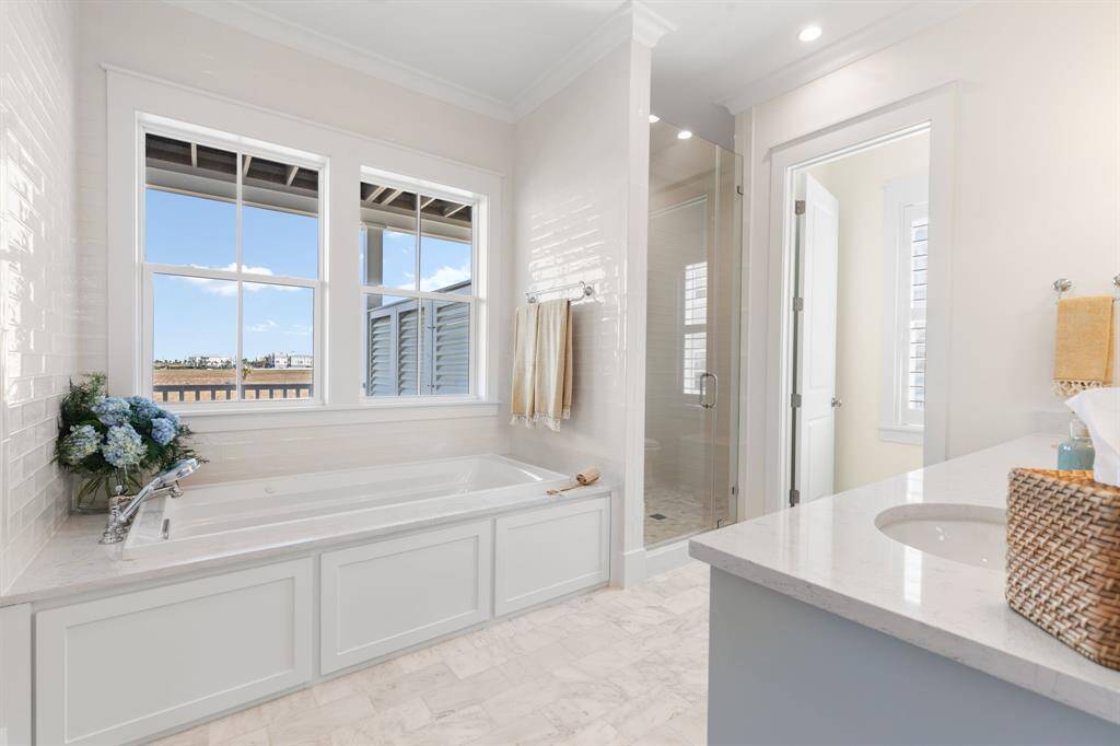 Primary Bath features a whirlpool tub