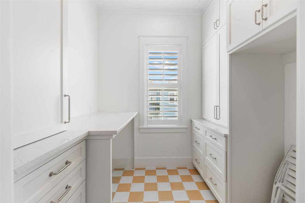 Laundry Room offers plenty of storage and space for an additional refrigerator