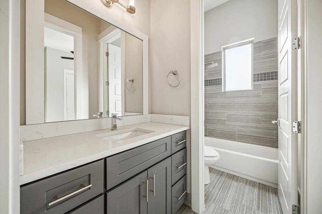 On-trend colors and tile define the secondary bathroom.