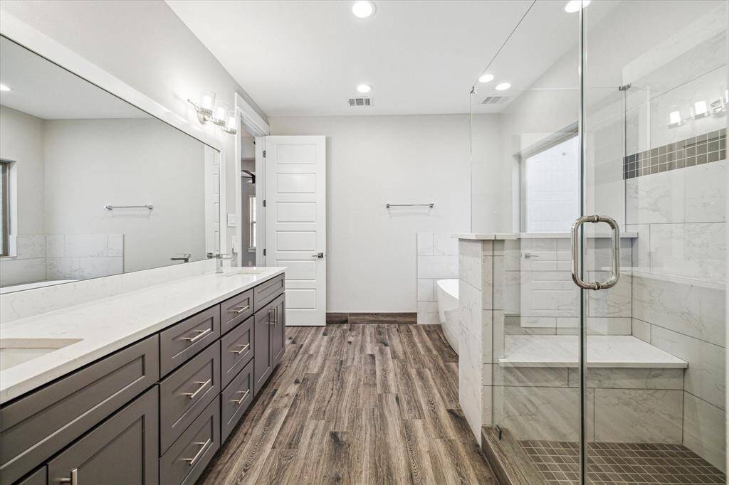 The spa-like primary bath is a welcome retreat. Stand alone soaking tub, walk-in shower with seamless glass and dual vanities are just some of the features.