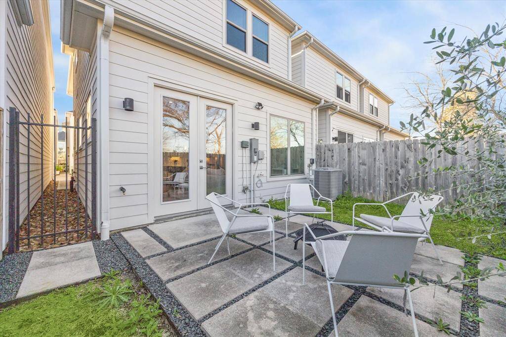 What a great spot for your morning coffee or to unwind with a glass of wine on this lovey sculptural patio. Plenty of space for your grill and a dog!