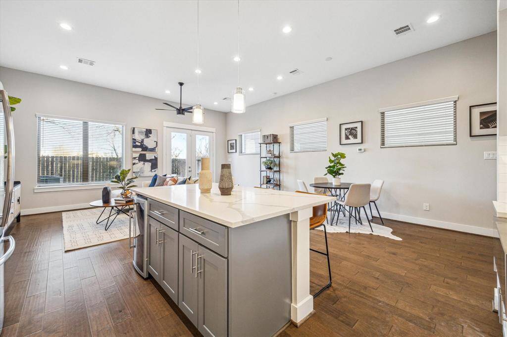 Huge windows to the back yard and smaller ones along the south wall ensure plenty of ambient light throughout the first floor.