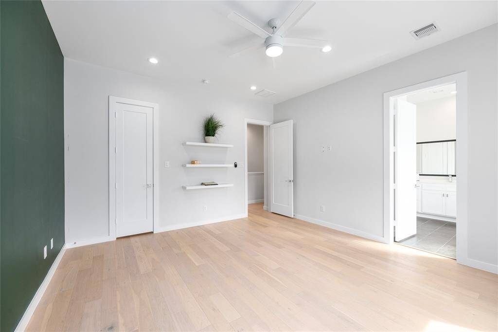 WOW...check out this massive primary Bedroom! Two separate closets, no carpet, tons of natural lighting and a gorgeous ensuite primary bathroom are great features to this space!