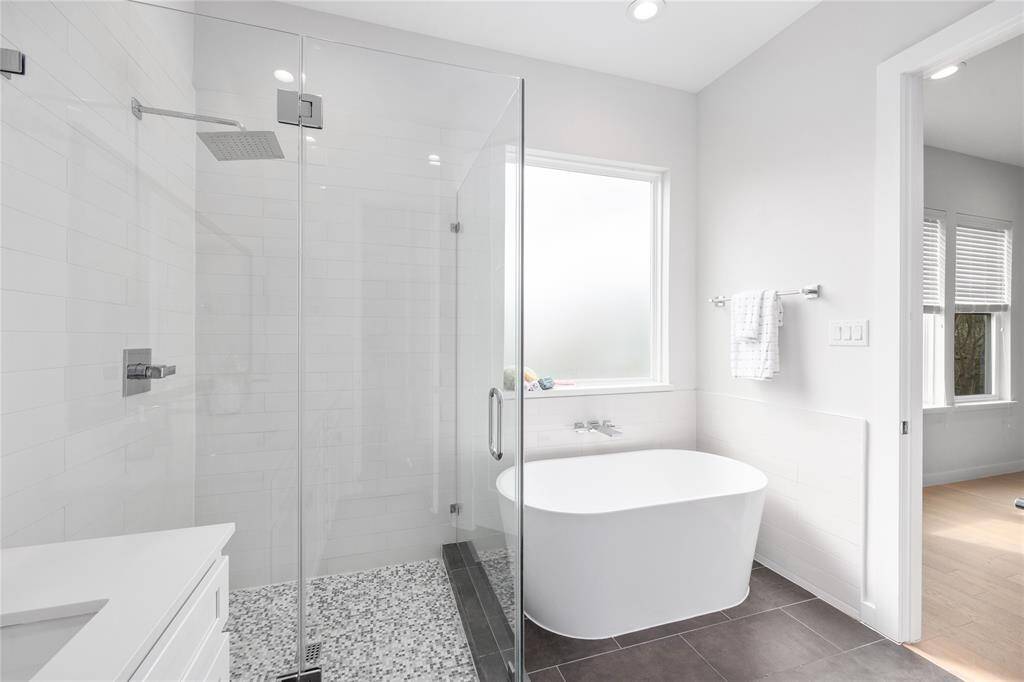 Let the stress of the day wash away in this soaking tub, or the oversized shower!