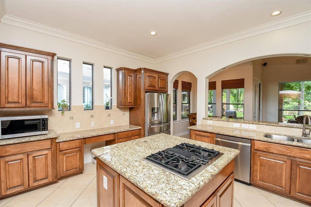 huge kitchen with island and wine fridge