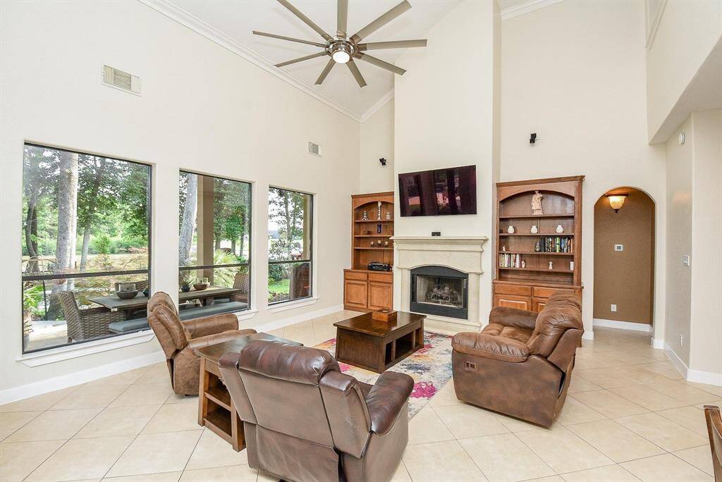 large living room with huge windows overlooking lake