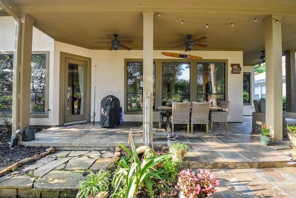 covered patio with doors leading to master bedroom