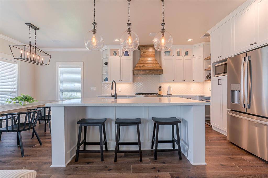 Additional seating at the grand island- beautiful pendant lighting