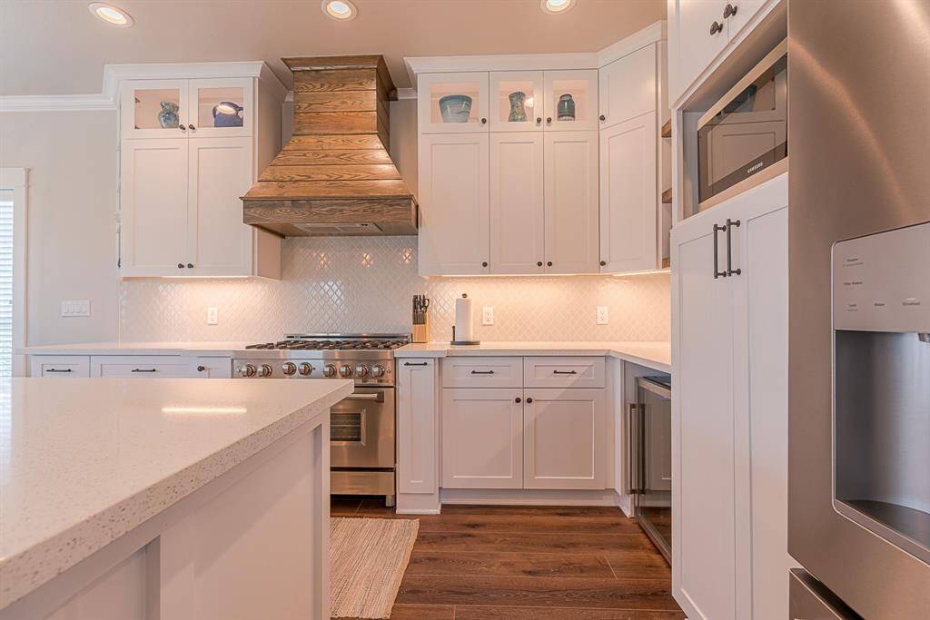 Modern shaker style cabinetry and custom vent hood