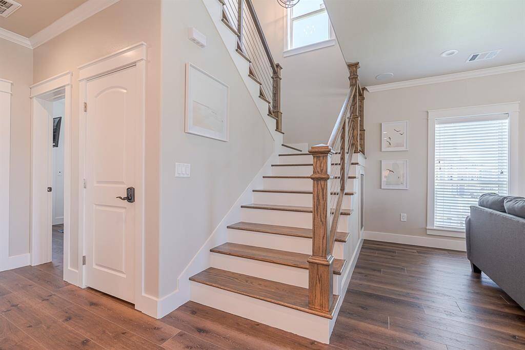 Hardwood floors leading upstairs