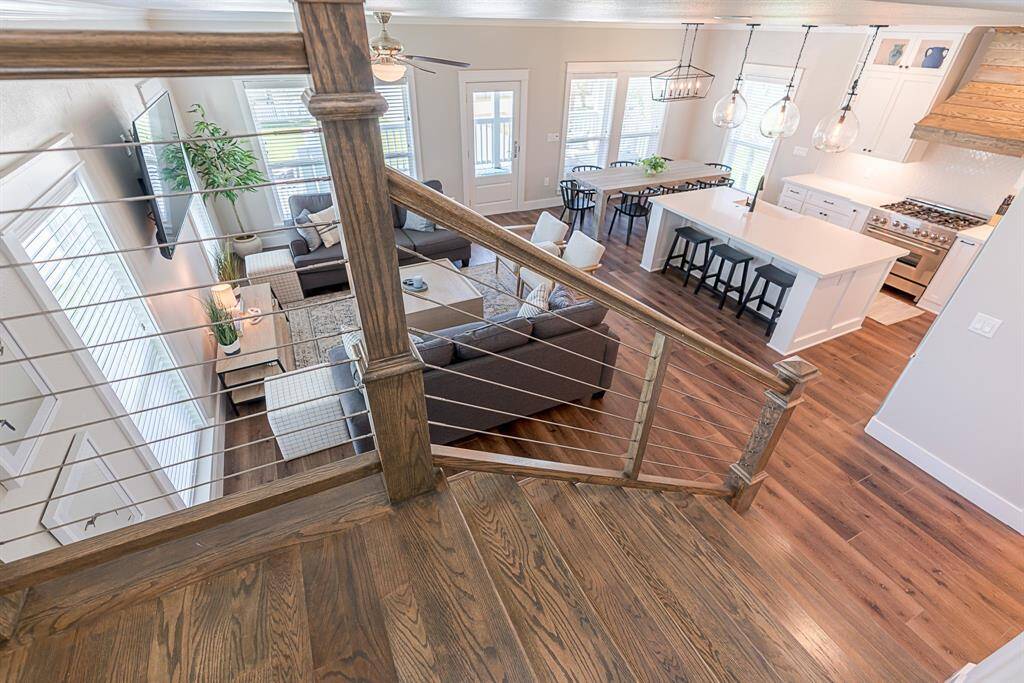 Beautiful hardwood floors throughout and modern wire railings