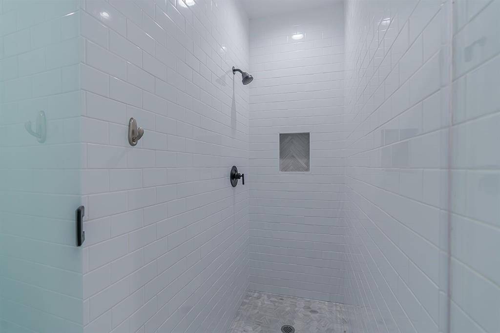 One of two, fully tiled, stand alone showers