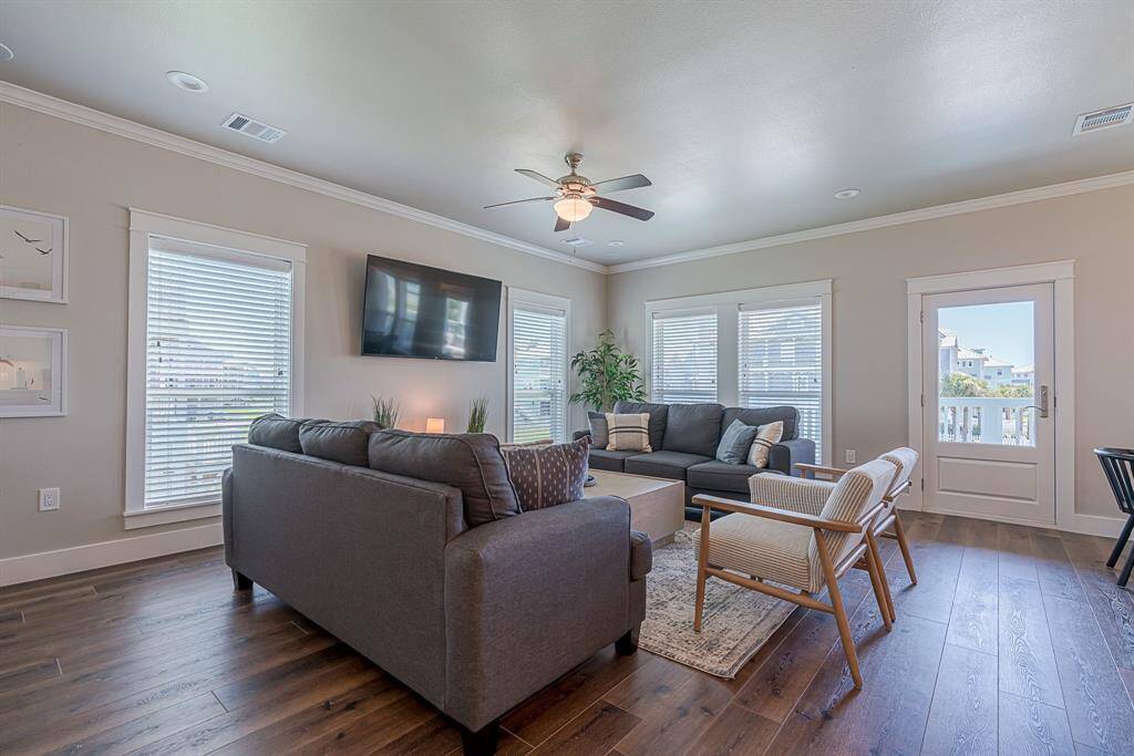 Living room area surrounded by walls of windows