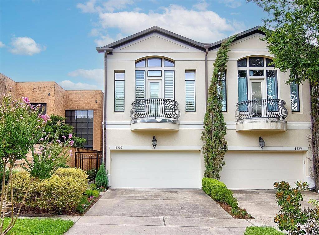 Beautiful exterior townhome with plantation shutters throughout