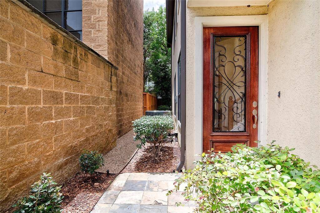 Landscaped gated side entrance