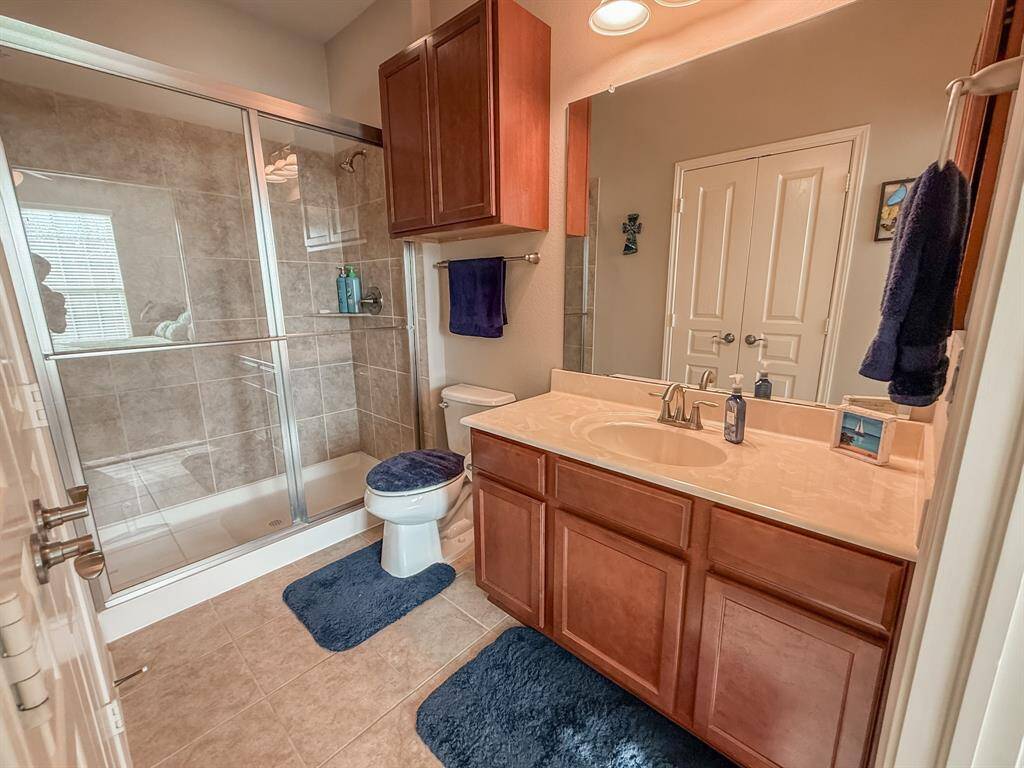The secondary bedroom has an ensuite bath with a large oversized walk in shower.