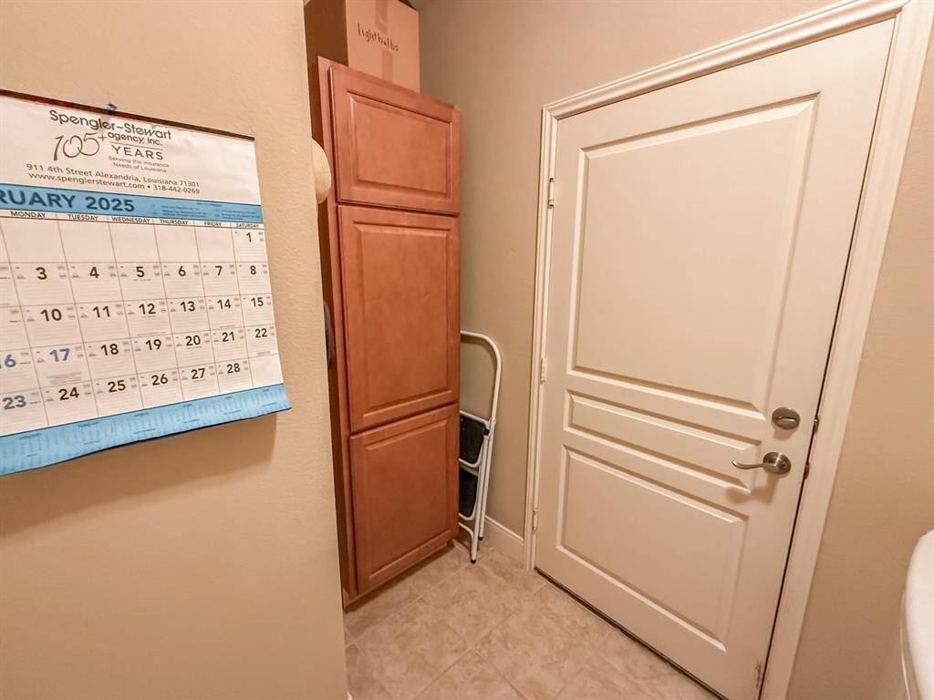 More of the laundry room with it's storage area