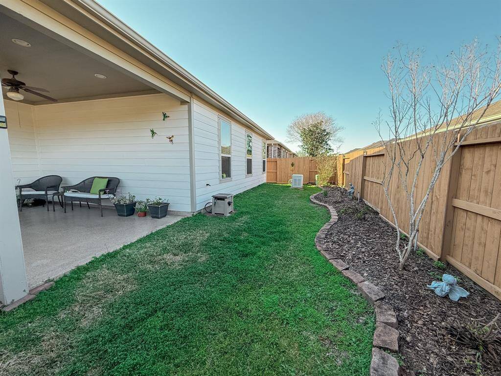 The fence was recently installed and the yard is beautifully landscaped, planted with perennials that will soon start sprouting up! Note the Generac full house generator at the end of yard!
