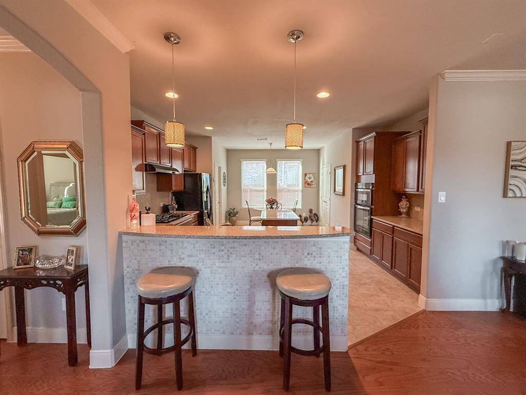 The  kitchen will be a dream to cook in!  It overlooks the family room and has a great breakfast bar.  The owner had pretty tile installed under the bar to protect it from the feet of those sitting at the bar.