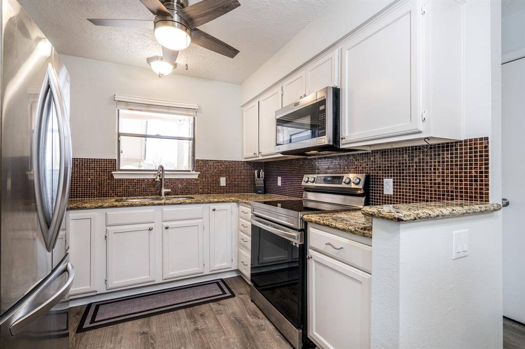 With granite counters, a French door refrigerator and lots of counter space and light, meal prep will be a breeze.