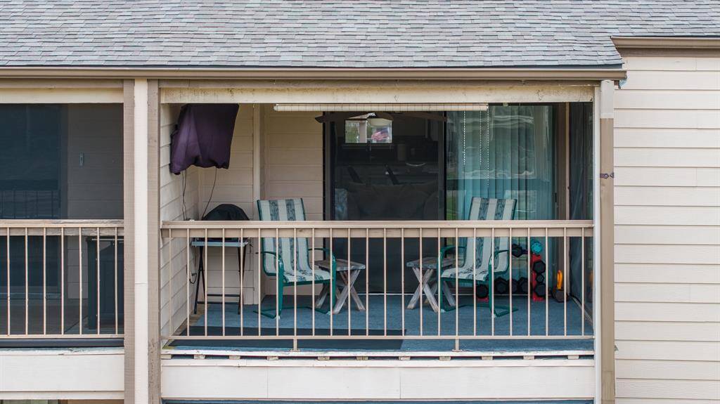 Your perfect patio with roll down shade and views of the pool and the lake.