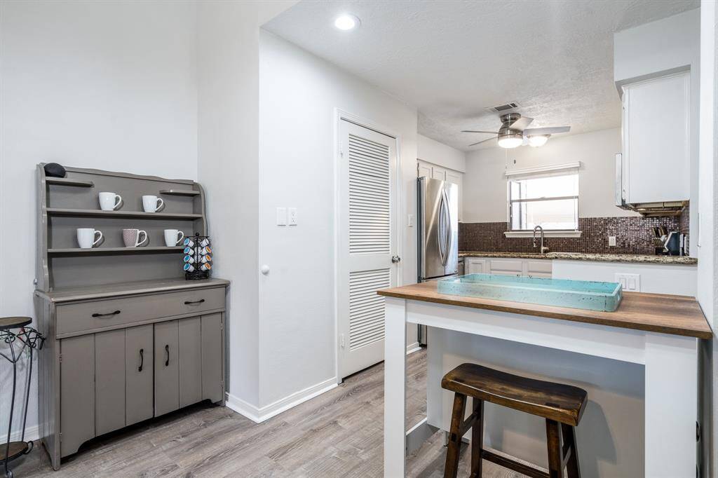Your kitchen has granite counters, in home laundry, lots of counter space and a fan to keep you nice and comfortable while you are cooking.