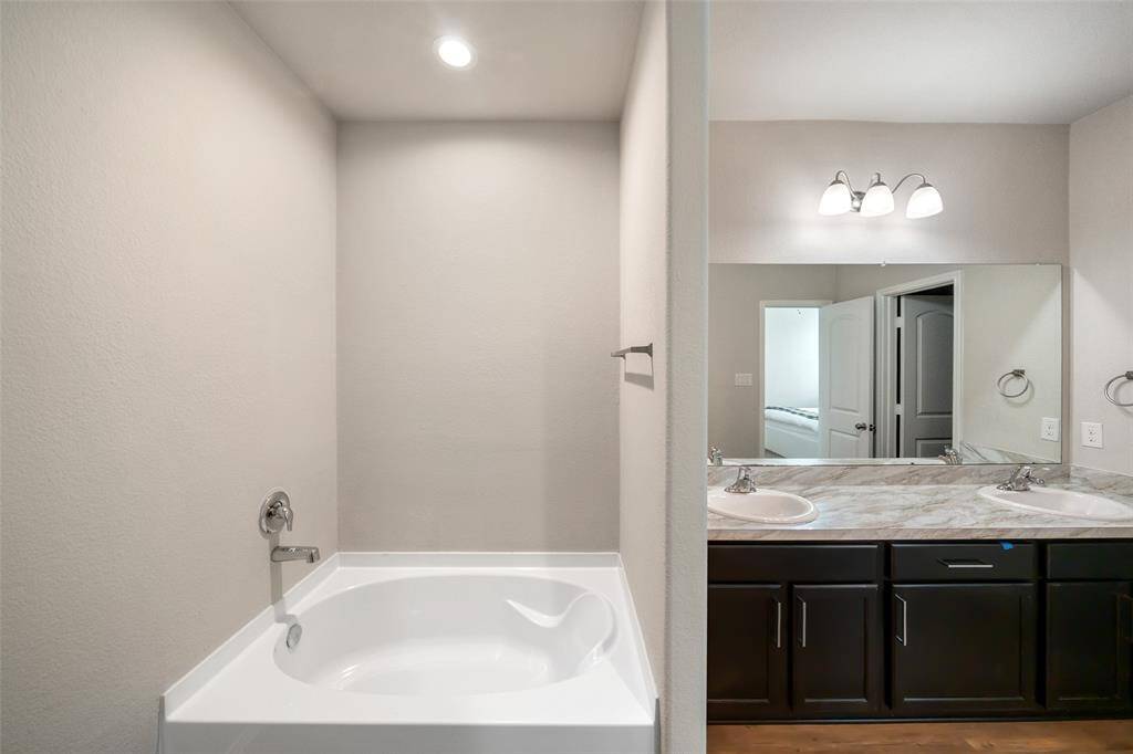 A walk-in shower, and a deep soaking tub—perfect for unwinding after a long day