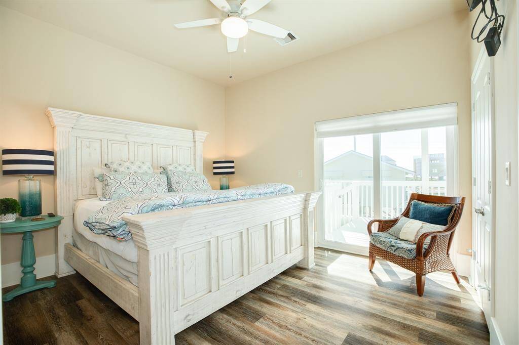 View of the primary bedroom and deck access with gulf views.