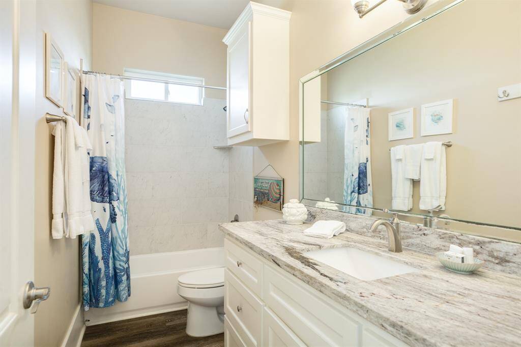 The hallway bathroom is well appointed and located between bedrooms two and three.