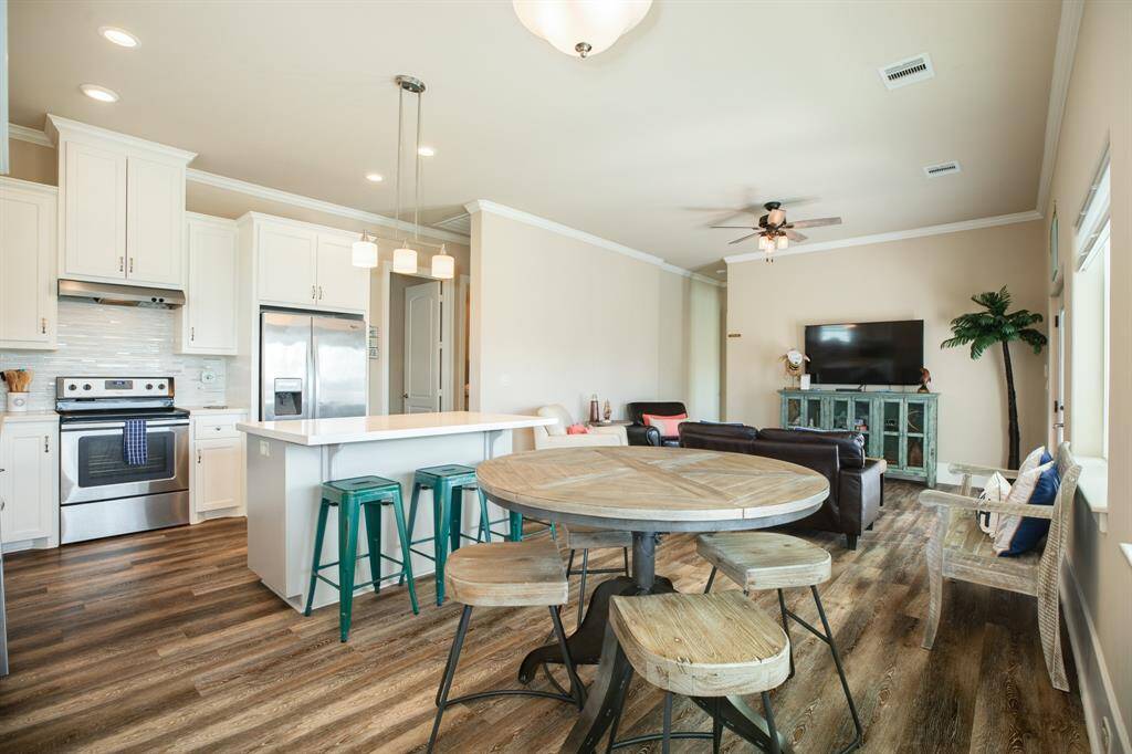 View from the dining of kitchen facing hallway that leads to bedrooms two and three.