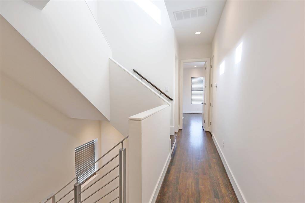 A thoughtfully designed hallway leads to the spacious secondary bedroom, offering privacy and comfort. Each bedroom in this stunning home is ensuite, providing ultimate convenience and luxury. With elegant finishes and a seamless layout, this home is perfect for modern living.