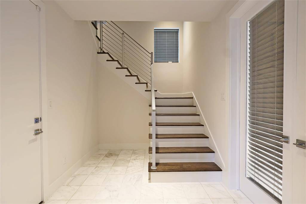 A gorgeous entrance leads to the first-floor ensuite bedroom, offering both style and privacy.