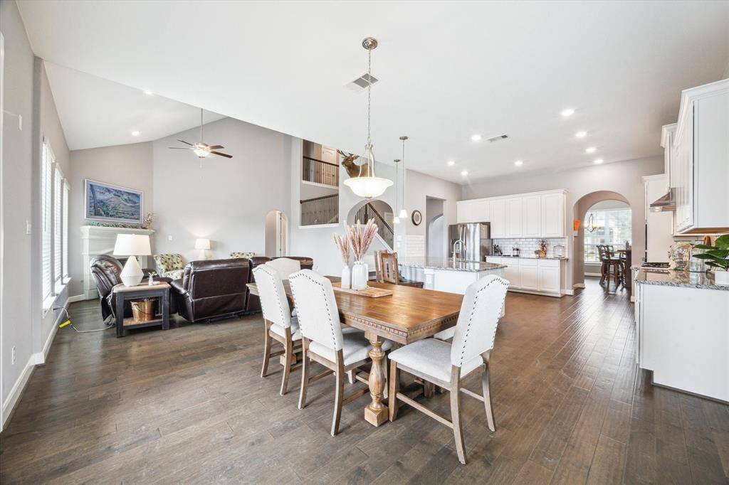 Bright and spacious breakfast area with a view of the back patio, comfortably seats six.