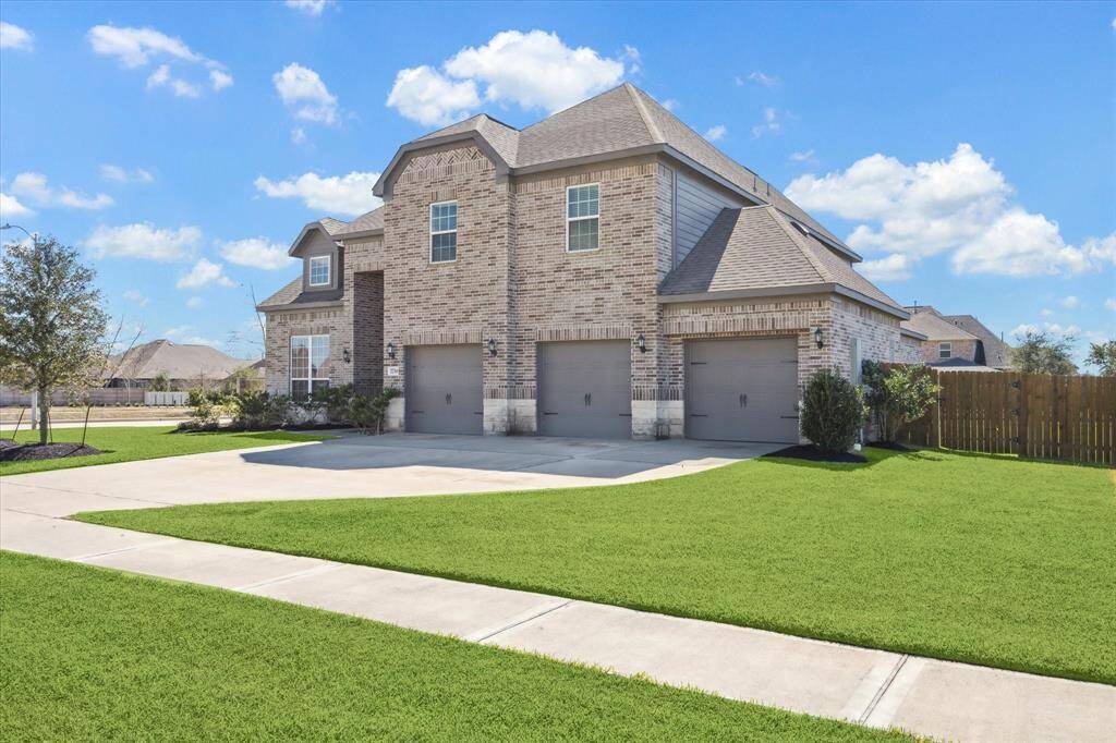 Stunning brick and stone facade on a spacious corner lot.