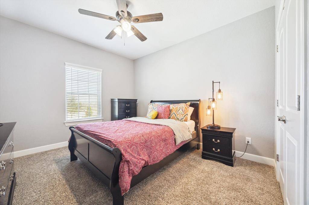 Third guest bedroom upstairs.  All upstairs bedrooms feature cozy carpet, ceiling fans, and 2" blinds.