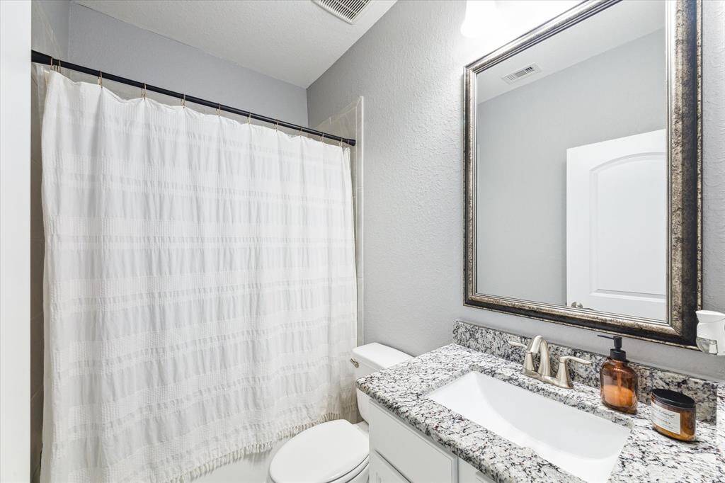 Second full bath upstairs also features neutral paint, granite and designer touches.