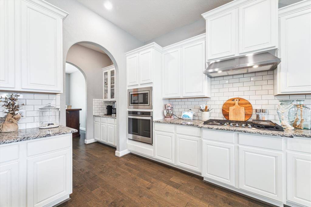 Tucked conveniently off the kitchen is the butler's pantry and walk-in-pantry!
