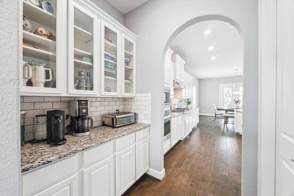 Another view of the butler's pantry with glass cabinets to showcase your decorative glassware.  This is a perfect location for small appliances and coffee bar!