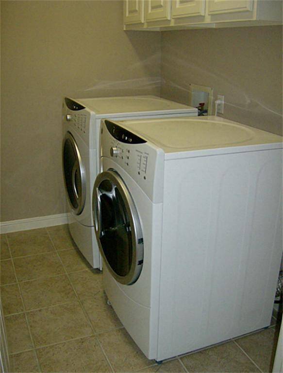 Front load washer and dryer in second floor utility room